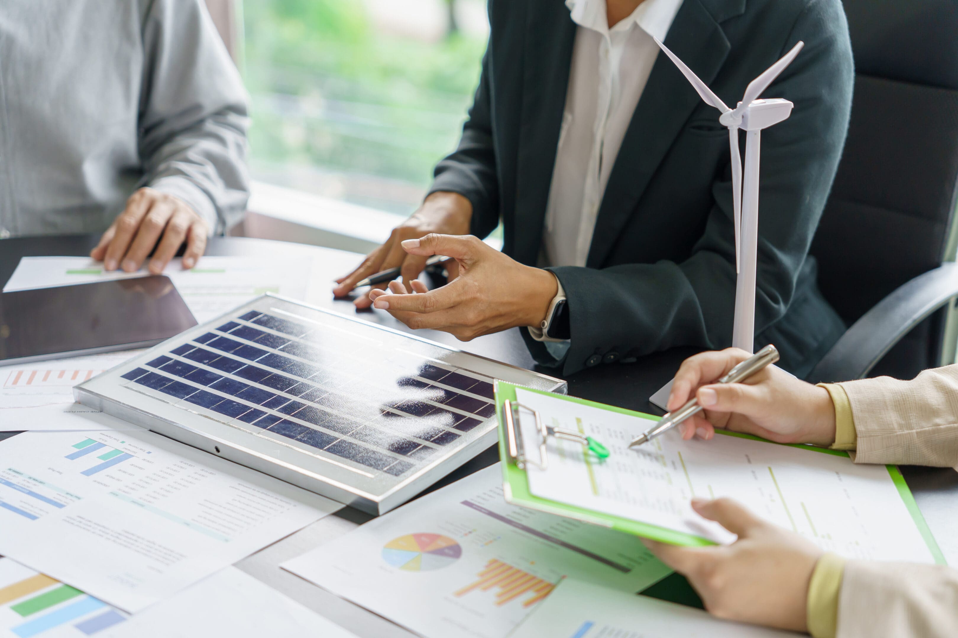 Solar panels green energy Business people working in green eco friendly office business meetingÂ creative ideas for business eco friendly professional teaching corporate people sustainable electricity